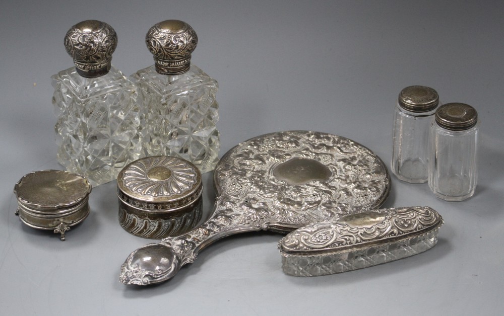 A late Victorian silver circular box and cover, a pair of similar silver mounted glass scent bottles, etc